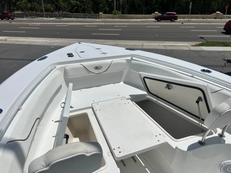 Slide: The Image of 2018 Sea Hunt Gamefish 25 boat interior with open storage compartments. - 7