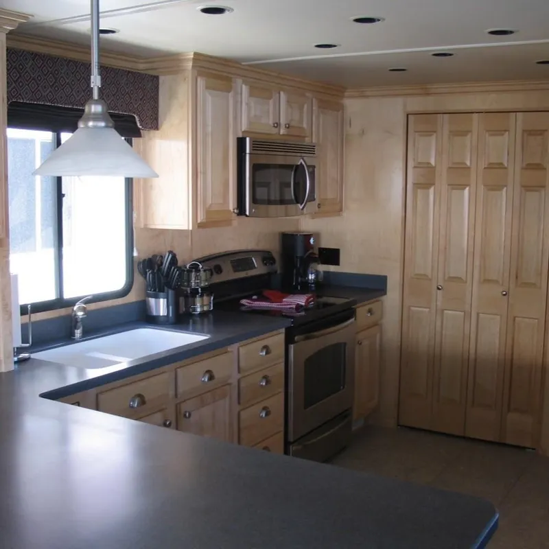 Slide: The Image of Modern kitchen in a 2008 Sumerset Red Rocks Trip 5 houseboat with stainless steel appliances. - 10