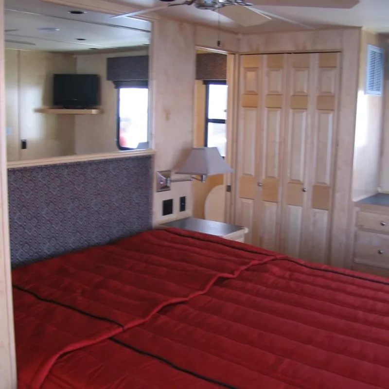 Slide: The Image of Interior of 2008 Sumerset Red Rocks Trip 5 houseboat bedroom with red bedding. - 11