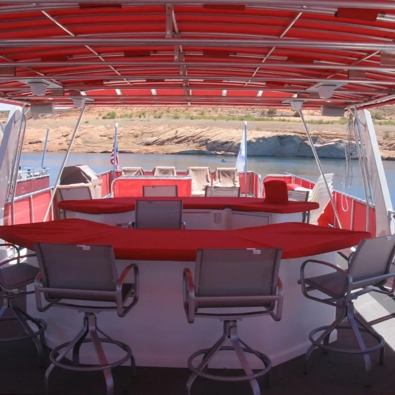 Slide: The Image of 2008 Sumerset Red Rocks Trip 5 houseboat with red canopy and bar stools on deck. - 15