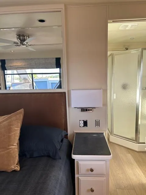 Slide: The Image of Sumerset Red Rocks Trip 5 houseboat bedroom with bedside table and shower, 2008 model. - 19