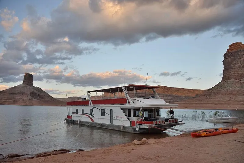 Slide: The Image of Sumerset Red Rocks Trip 5 houseboat docked on a serene lake, 2008 model. - 2