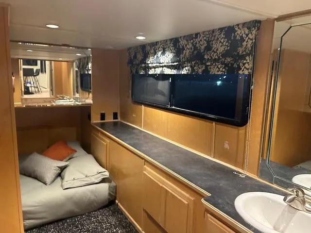 Slide: The Image of Interior of 2008 Sumerset Red Rocks Trip 5 houseboat with cozy sleeping area and sink. - 24