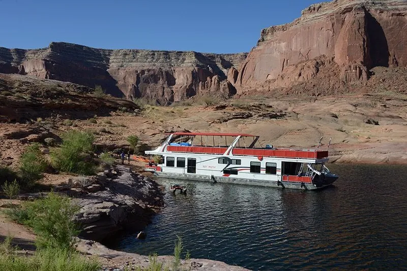 Slide: The Image of Houseboat Sumerset Red Rocks Trip 5, 2008, docked by rocky desert cliffs. - 3