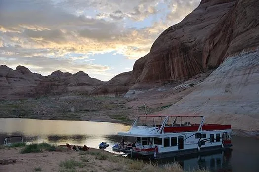 Slide: The Image of 2008 Sumerset Red Rocks Trip 5 houseboat docked by scenic canyon at sunset. - 5