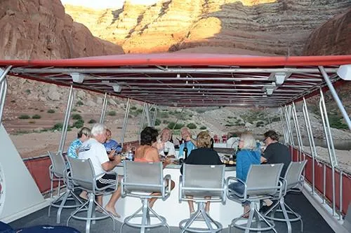 Slide: The Image of Group enjoying a meal on a 2008 Sumerset Red Rocks Trip 5 houseboat. - 8