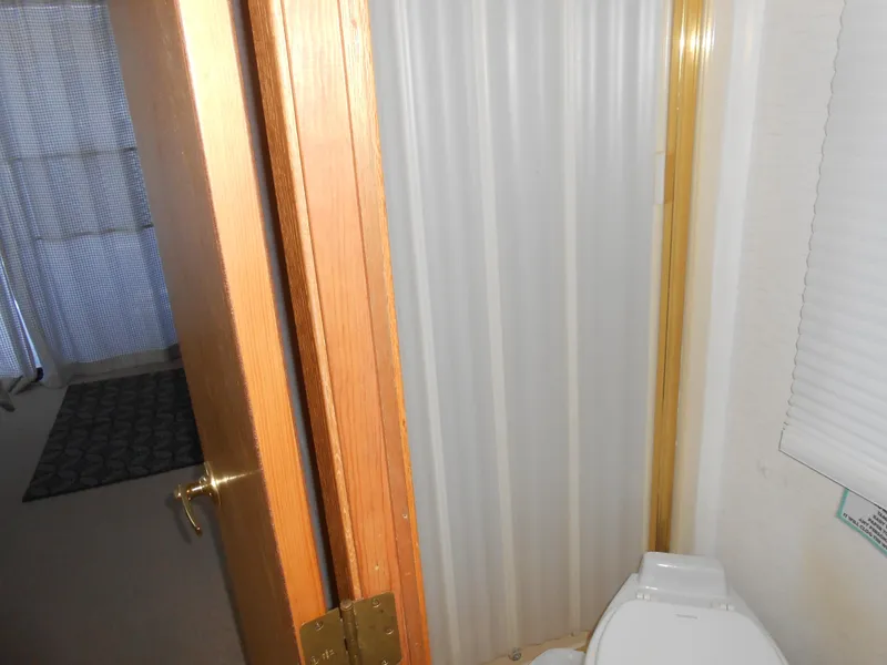 Slide: The Image of 1990 Skipperliner Custom Houseboat bathroom with shower and toilet. - 20