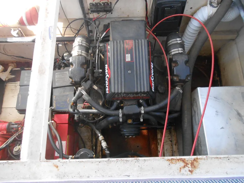 Slide: The Image of Engine compartment of a 1990 Skipperliner Custom Houseboat, featuring a MerCruiser engine. - 6