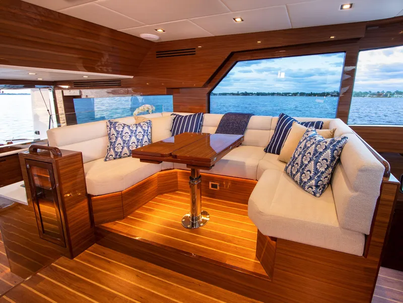 Slide: The Image of Luxurious interior of 2025 Summit 54 yacht with plush seating and scenic window view. - 4