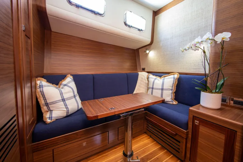 Slide: The Image of Luxurious interior of 2025 Summit 54 yacht with cozy seating and elegant decor. - 9