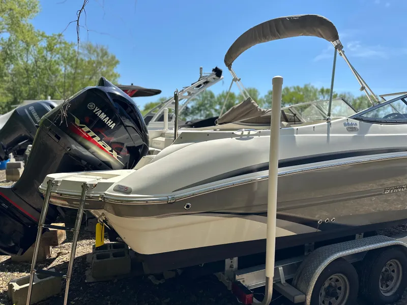 Slide: The Image of 2016 Stingray 234 LR boat on trailer with Yamaha outboard motor. - 41