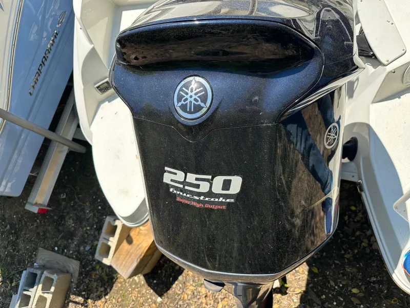 Slide: The Image of Yamaha 250 outboard motor on 2016 Stingray 234 LR boat, parked outdoors. - 43