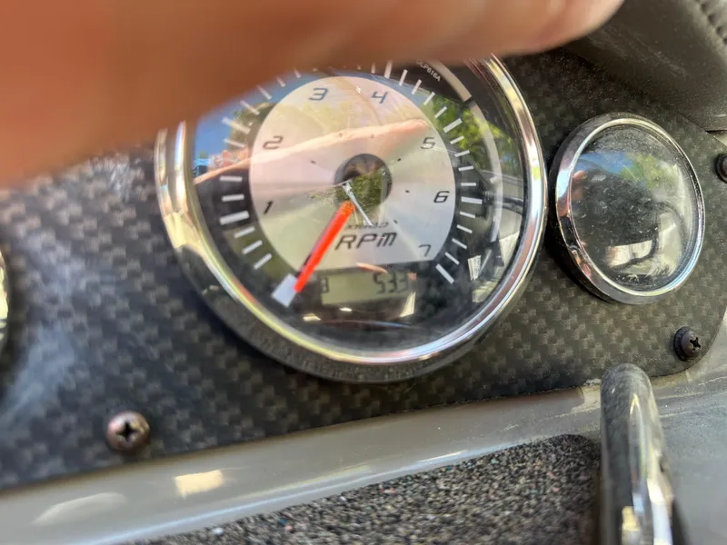 Slide: The Image of Close-up of 2016 Stingray 234 LR RPM gauge on carbon fiber dashboard. - 44