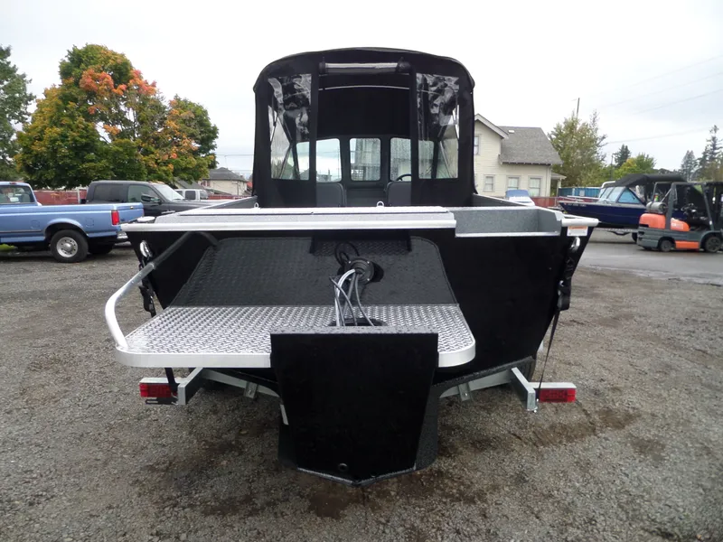 Slide: The Image of 2018 Alumaweld Blackhawk boat rear view in a parking lot. - 3