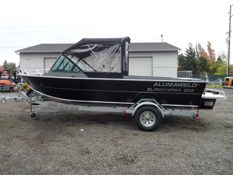 Slide: The Image of 2018 Alumaweld Blackhawk boat on Rogue trailer in outdoor setting. - 5