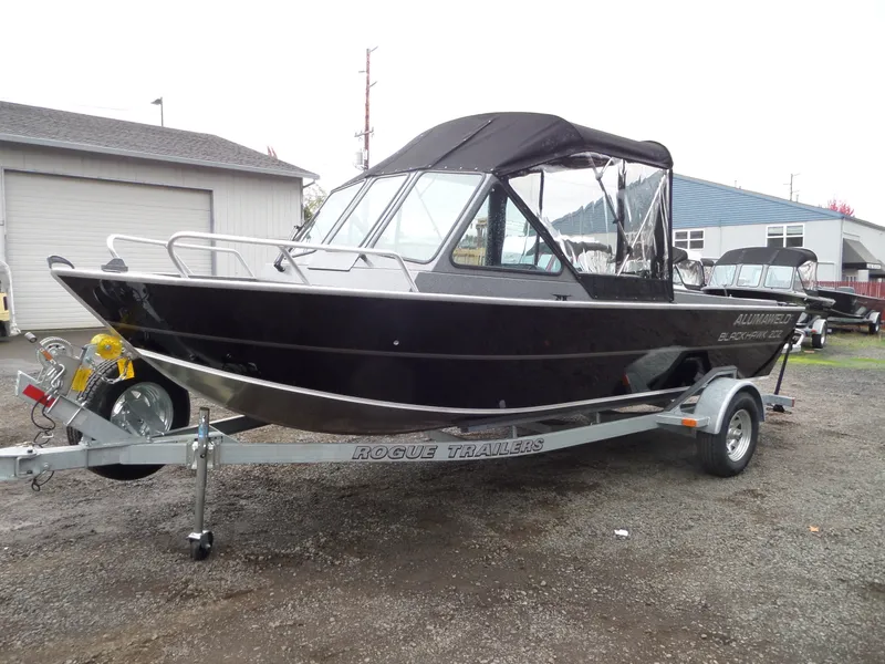 Slide: The Image of 2018 Alumaweld Blackhawk boat on Rogue trailer in outdoor setting. - 6