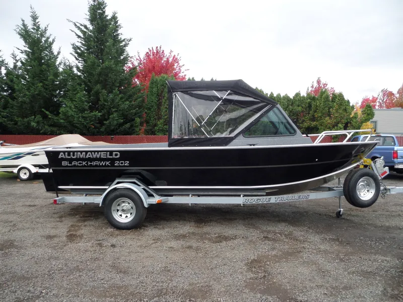Slide: The Image of 2018 Alumaweld Blackhawk boat on Rogue trailer in outdoor setting. - 9