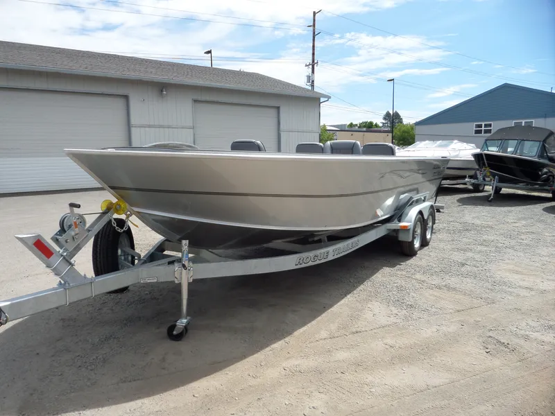 Slide: The Image of 2018 Alumaweld Columbia boat on a Rogue trailer in a parking lot. - 6