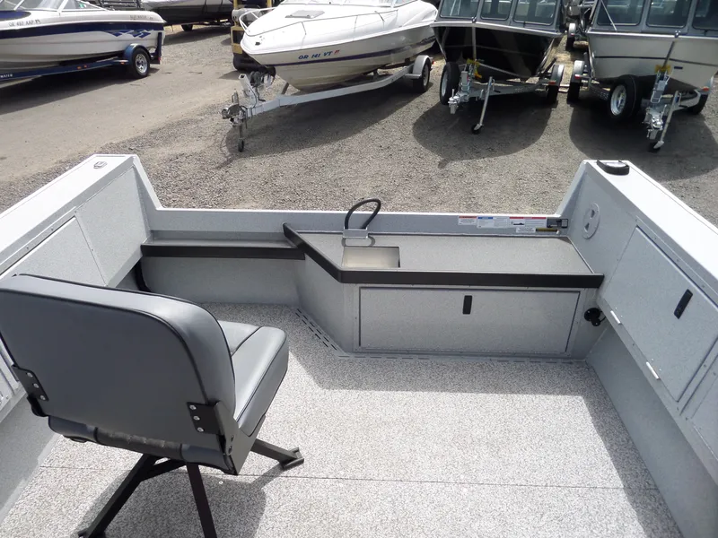 Slide: The Image of 2018 Alumaweld Columbia boat interior with seating and storage compartments. - 9