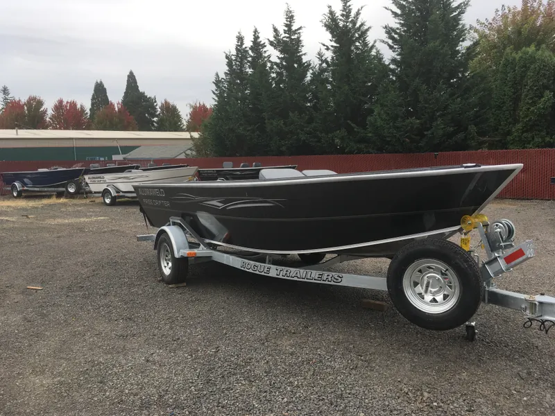 Slide: The Image of 2018 Alumaweld Free Drifter boat on a Rogue trailer in a lot. - 4