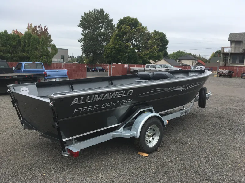 Slide: The Image of 2018 Alumaweld Free Drifter boat on a trailer in a parking lot. - 6