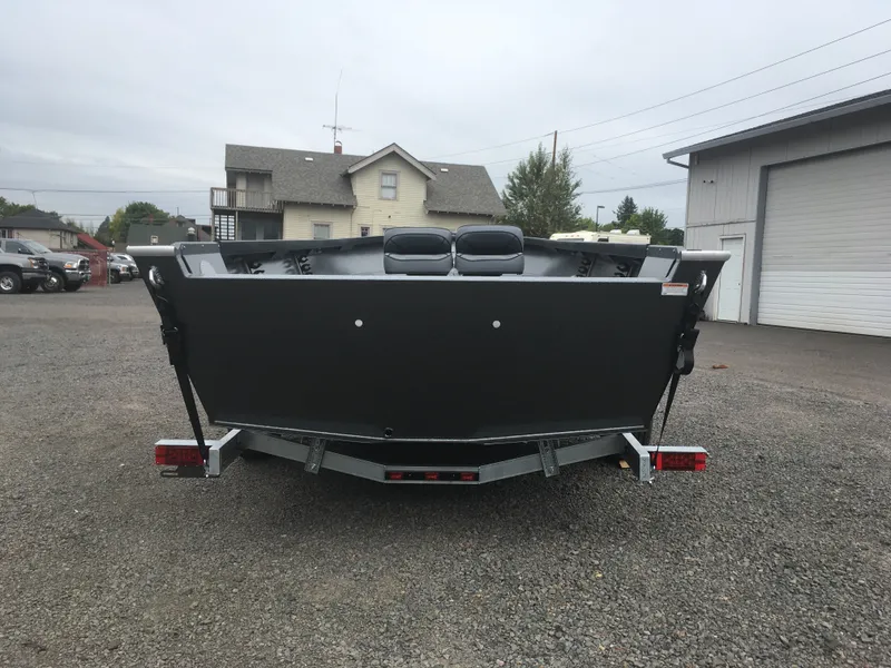 Slide: The Image of 2018 Alumaweld Free Drifter boat on a trailer, rear view in a parking lot. - 7