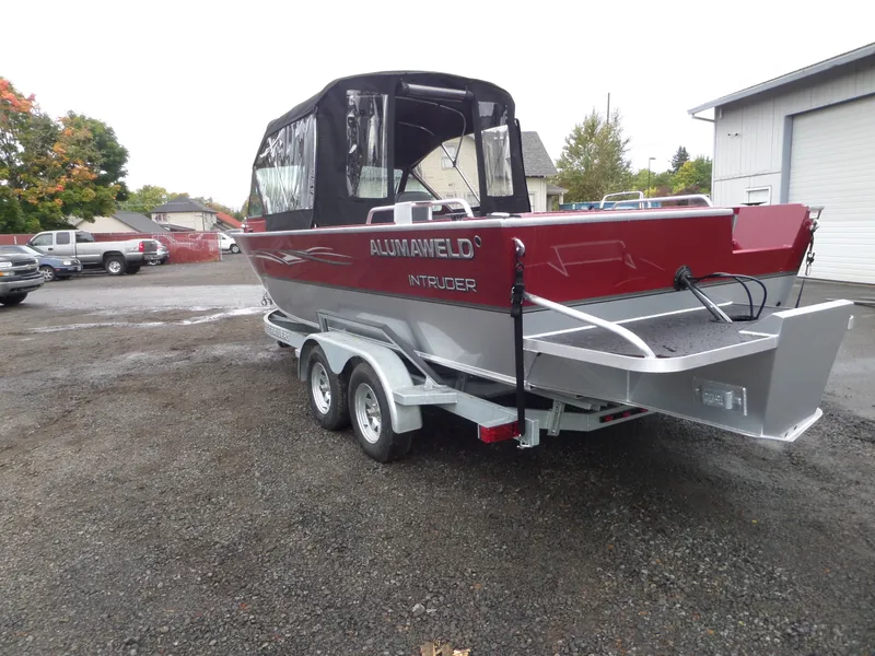 Slide: The Image of 2018 Alumaweld Intruder boat on a trailer in a parking lot. - 4