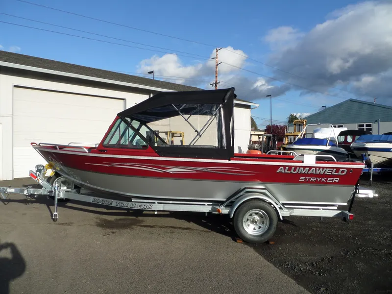 Slide: The Image of 2018 Alumaweld Stryker boat on Rogue trailer, parked outdoors. - 1