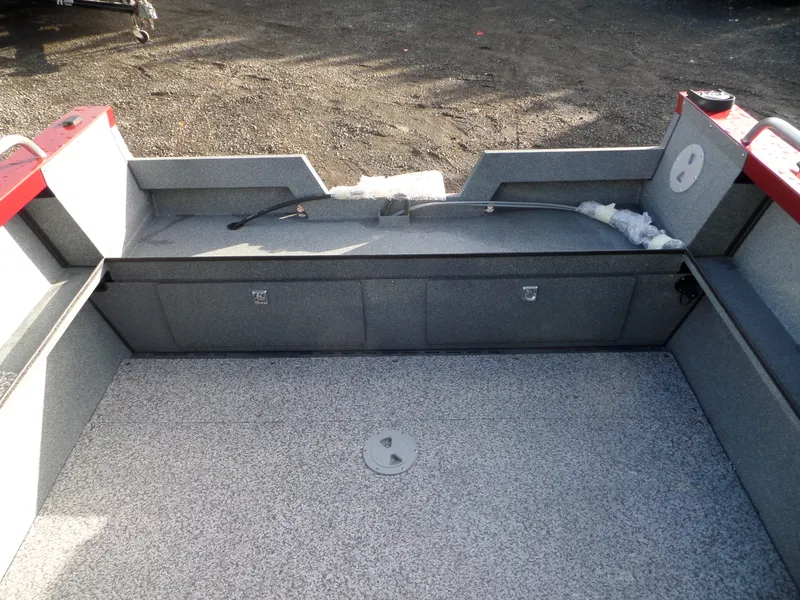 Slide: The Image of 2018 Alumaweld Stryker boat interior with storage compartments and clean deck. - 10