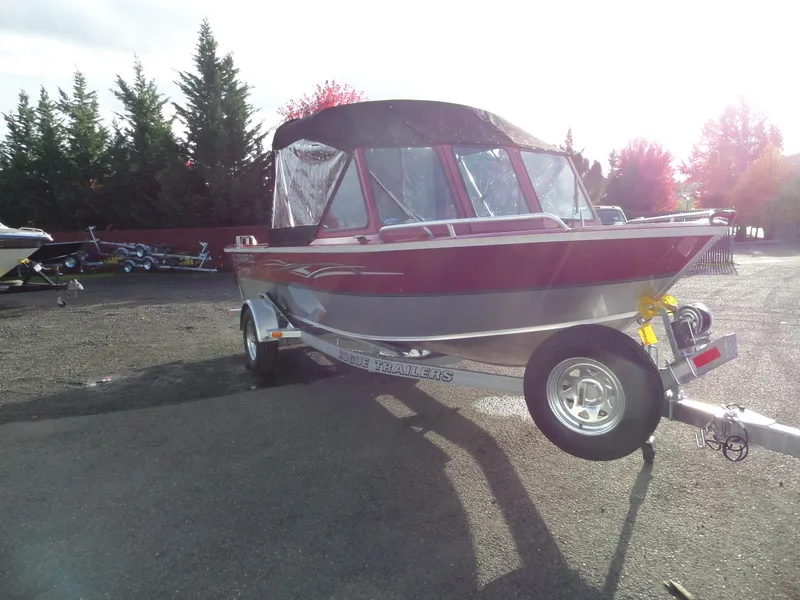 Slide: The Image of 2018 Alumaweld Stryker boat on trailer in outdoor setting. - 4