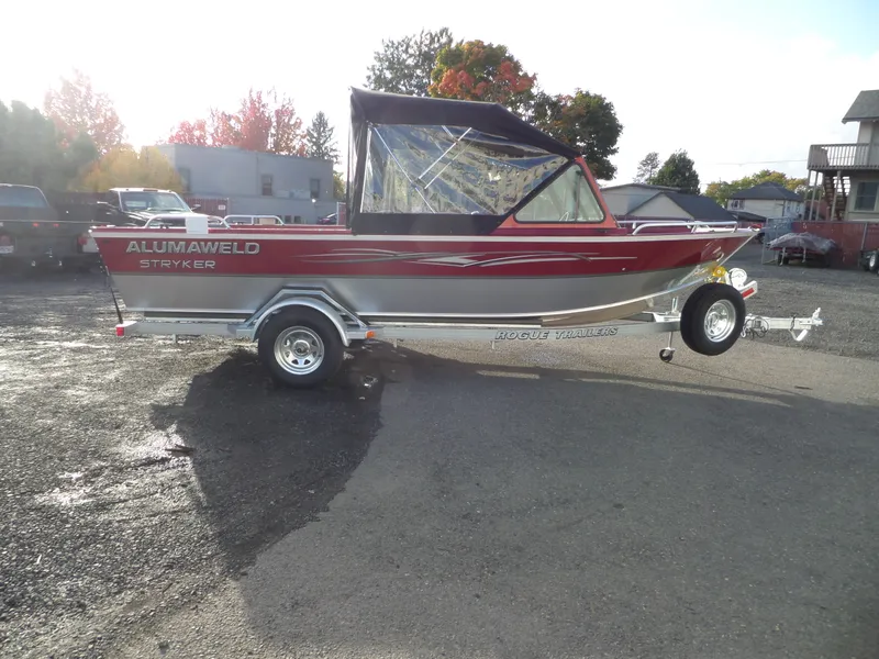 Slide: The Image of 2018 Alumaweld Stryker boat on Rogue trailer, parked outdoors. - 5