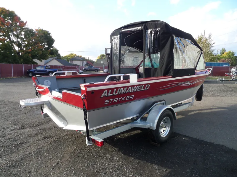 Slide: The Image of 2018 Alumaweld Stryker boat on trailer, red and silver, with black canopy. - 6