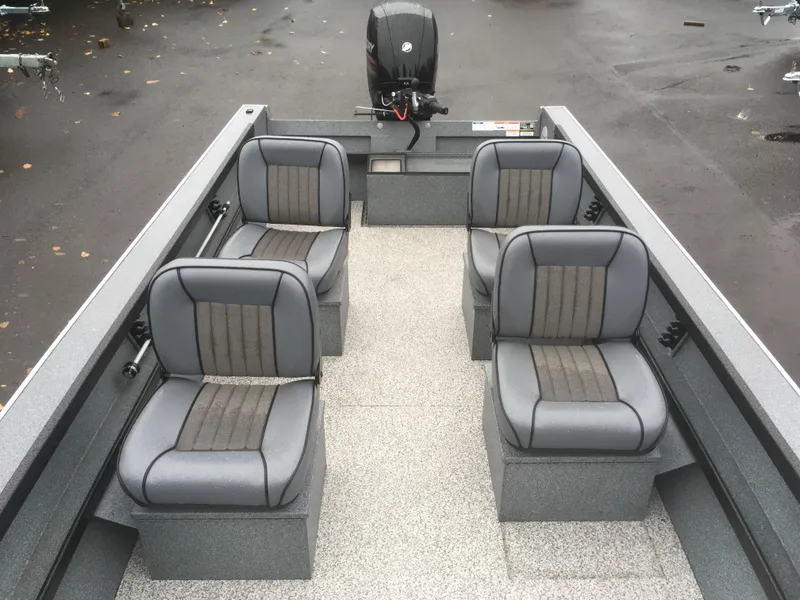 Slide: The Image of 2018 Alumaweld Super Vee boat interior with four gray seats and outboard motor. - 10