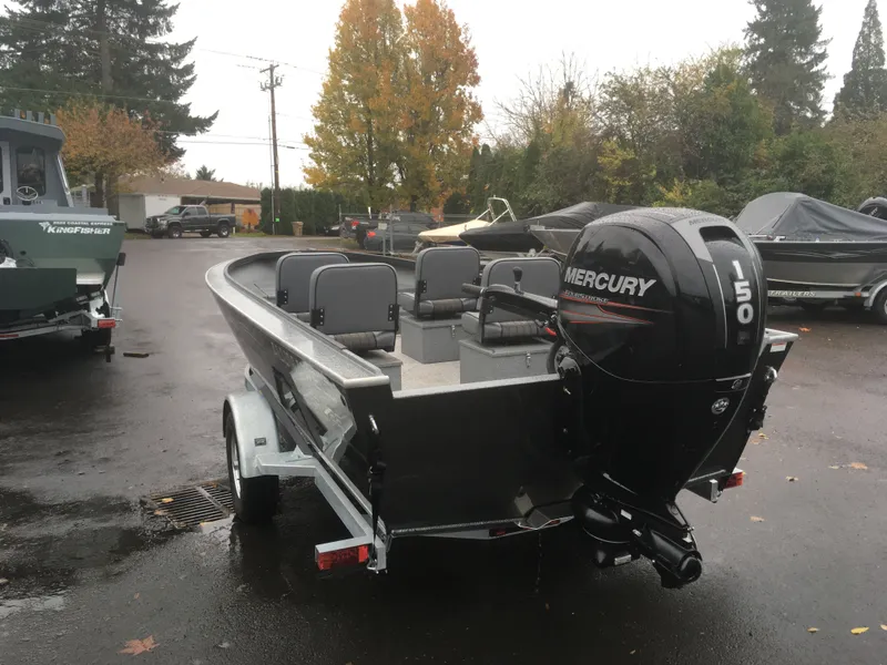 Slide: The Image of 2018 Alumaweld Super Vee boat with Mercury 150 outboard motor in parking lot. - 8