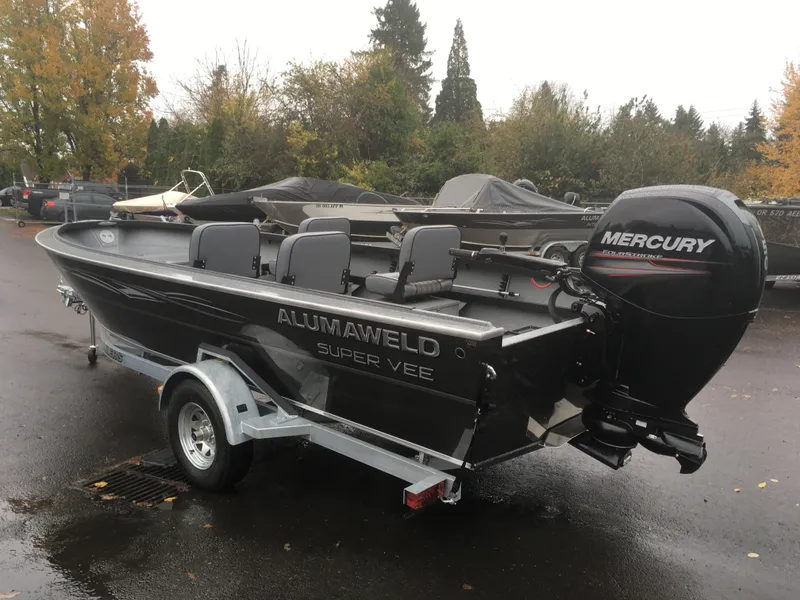 Slide: The Image of 2018 Alumaweld Super Vee boat with Mercury outboard motor on trailer. - 9
