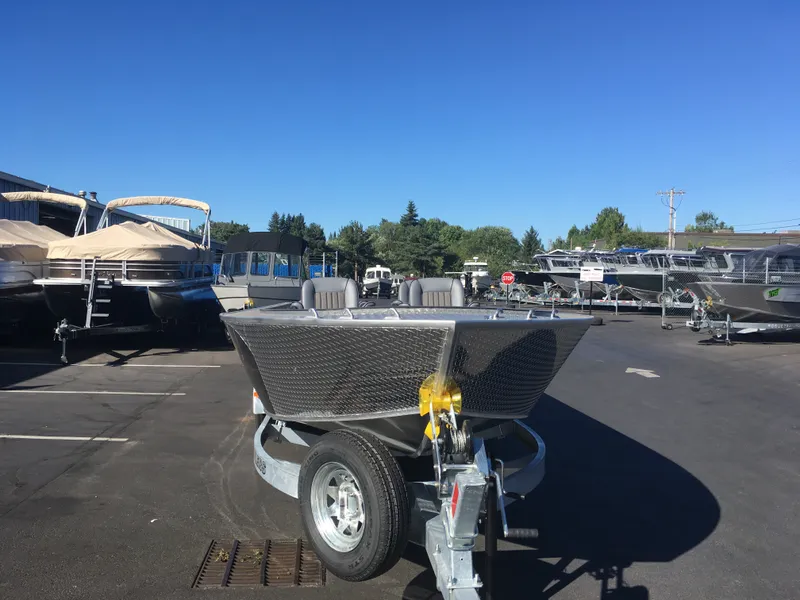 Slide: The Image of 2018 Alumaweld Super Vee Pro boat on trailer in a dealership lot. - 11