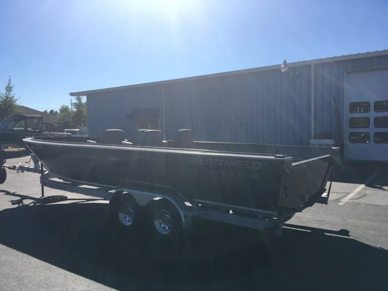 Slide: The Image of 2018 Alumaweld Super Vee Pro boat on a trailer in a parking lot. - 7