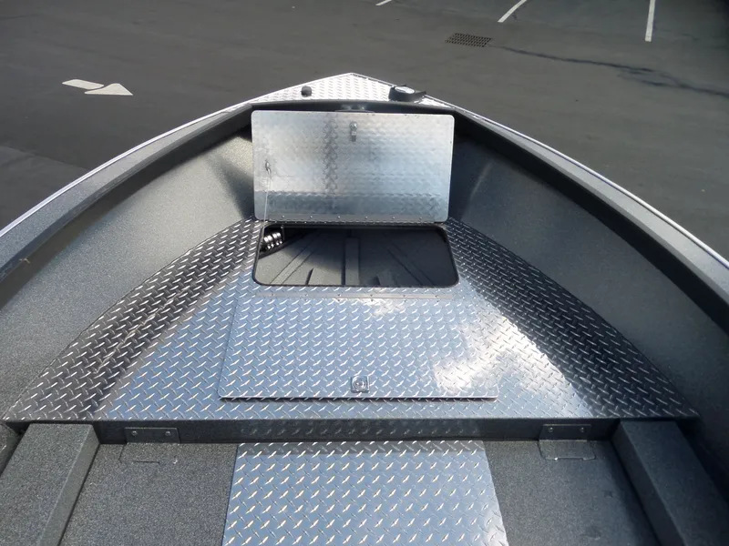 Slide: The Image of 2017 Alumaweld Free Drifter boat with diamond plate flooring and storage compartment. - 8