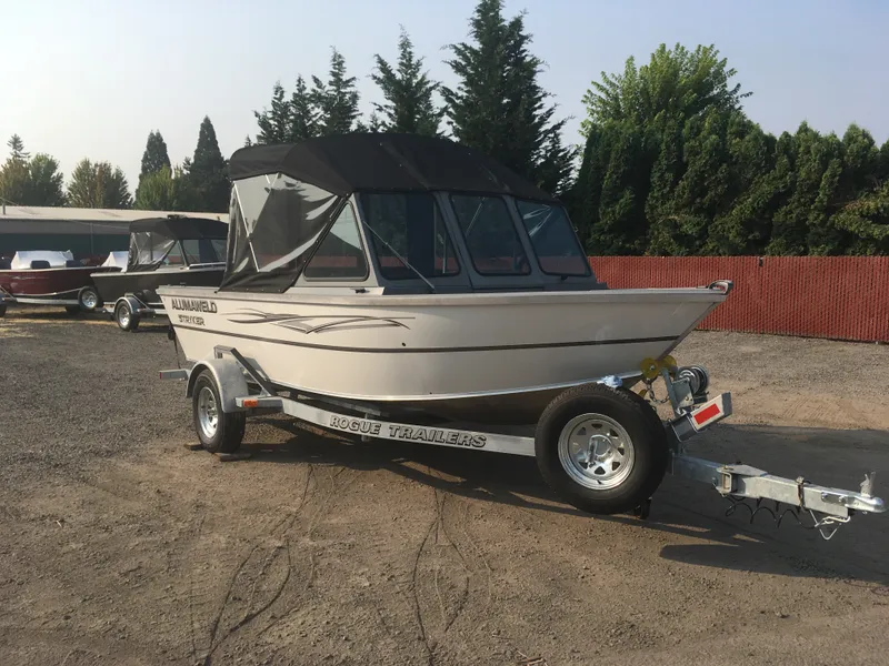 Slide: The Image of 2017 Alumaweld Stryker boat on Rogue trailer in outdoor lot. - 8