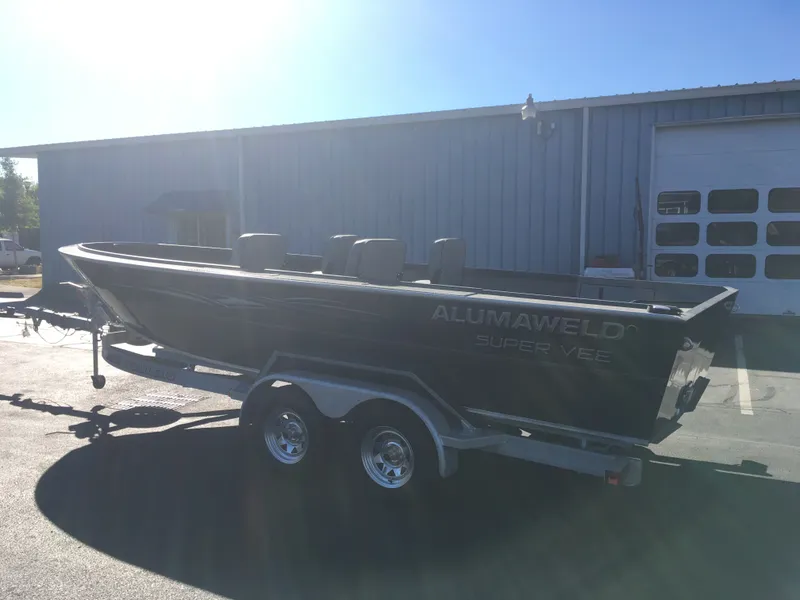 Slide: The Image of 2017 Alumaweld Super Vee Pro boat on a trailer in a parking lot. - 4