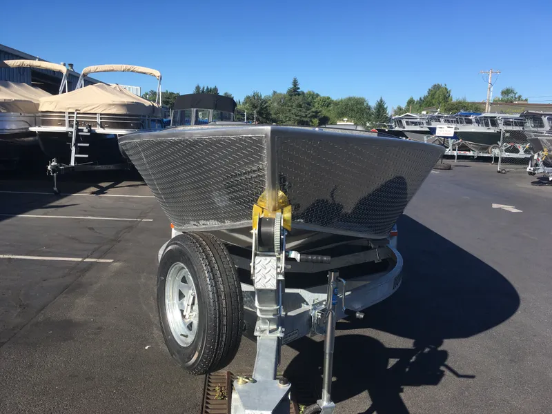 Slide: The Image of 2017 Alumaweld Super Vee Pro boat on trailer in a dealership lot. - 6