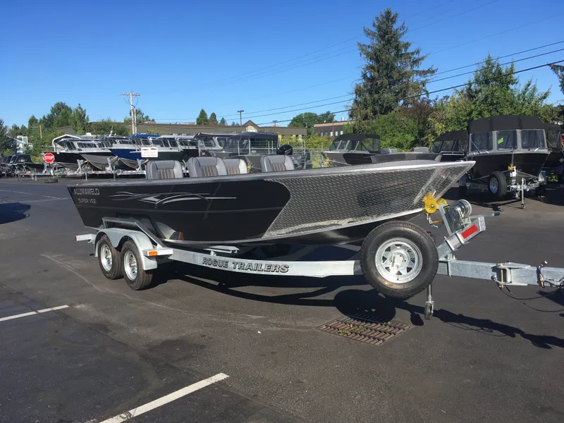Slide: The Image of 2017 Alumaweld Super Vee Pro boat on a Rogue trailer in a dealership lot. - 7