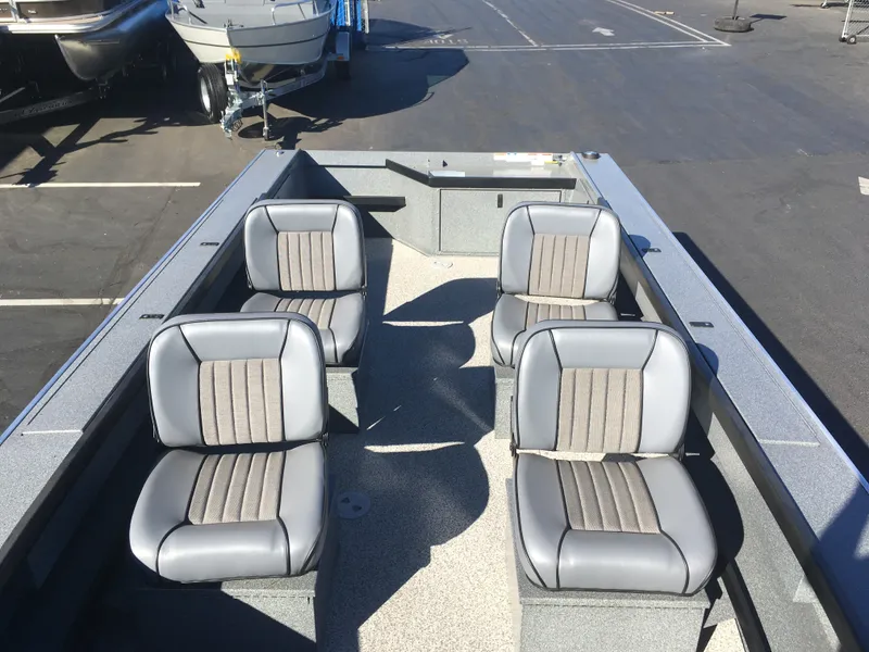 Slide: The Image of 2017 Alumaweld Super Vee Pro boat interior with four gray seats. - 9