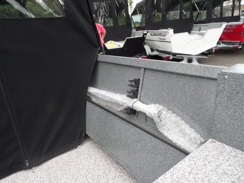Slide: The Image of 2017 Alumaweld TALON boat interior with protective bubble wrap and black cover. - 10