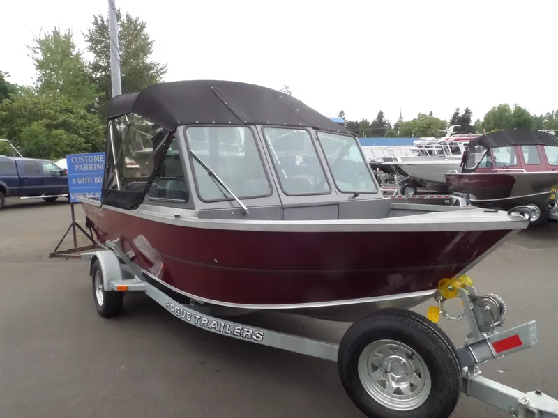 Slide: The Image of 2017 Alumaweld TALON boat on Rogue Trailer, maroon color, parked outdoors. - 4