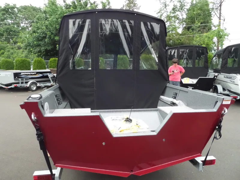 Slide: The Image of 2017 Alumaweld TALON boat with black canopy and red exterior. - 8