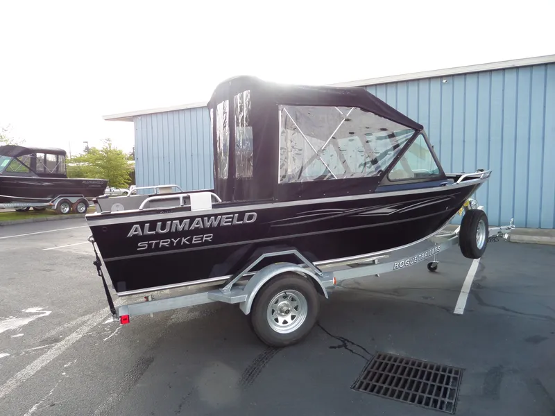 Slide: The Image of 2017 Alumaweld Talon boat on trailer, black with canopy, model Stryker. - 12