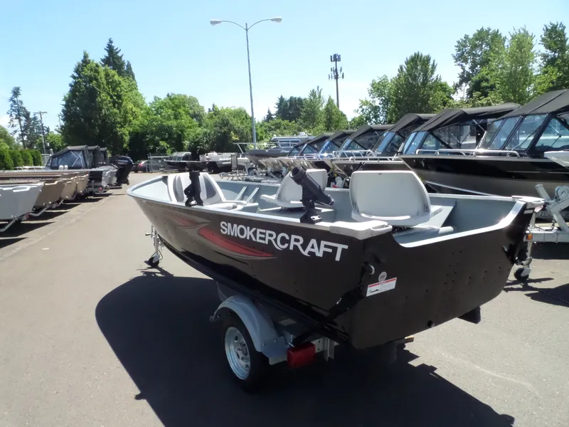 Slide: The Image of 2017 Smoker Craft Alaskan boat on trailer in outdoor showroom. - 11