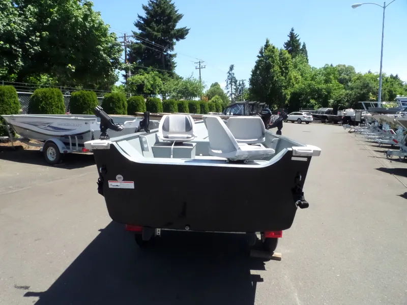 Slide: The Image of 2017 Smoker Craft Alaskan boat on trailer in outdoor lot. - 3