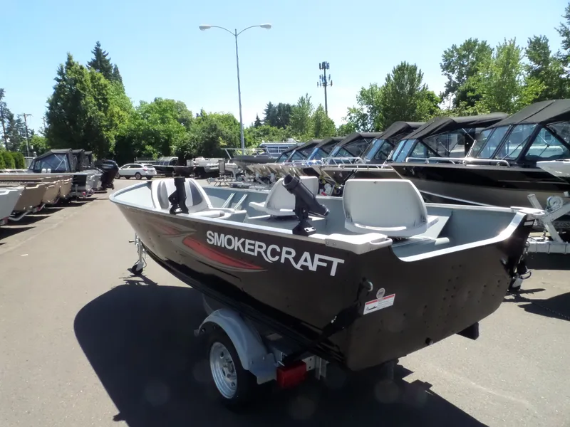 Slide: The Image of 2017 Smoker Craft Alaskan boat on trailer in outdoor lot. - 4